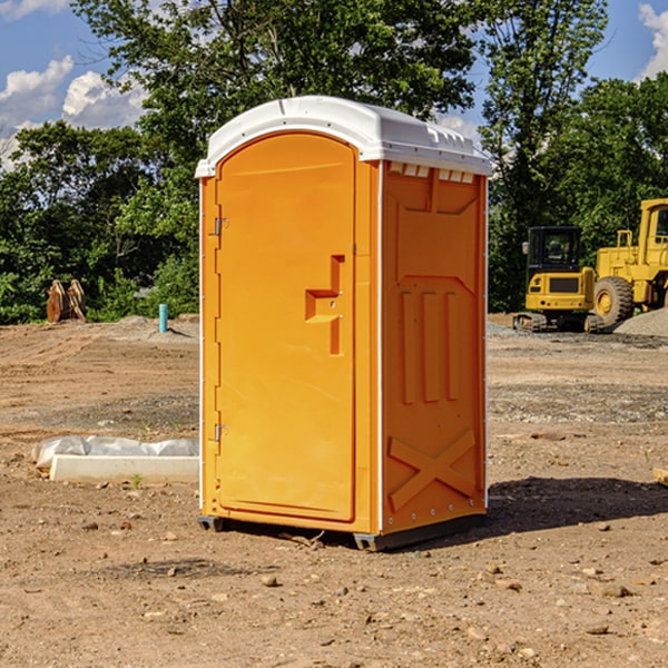 what is the cost difference between standard and deluxe portable restroom rentals in Thayer